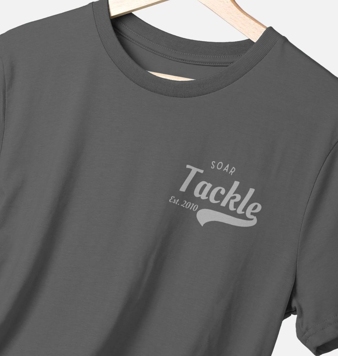 Gray t-shirt with 'SOAR Tackle Est. 2010' text on a hanger